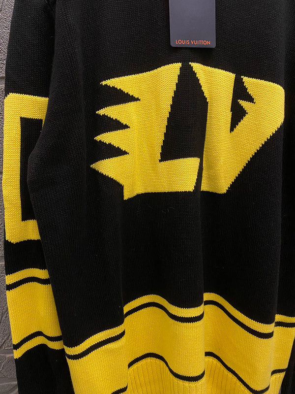 Close-up detail shot of Louis Vuitton luxury clothing with runway-inspired design