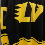 Close-up detail shot of Louis Vuitton luxury clothing with runway-inspired design