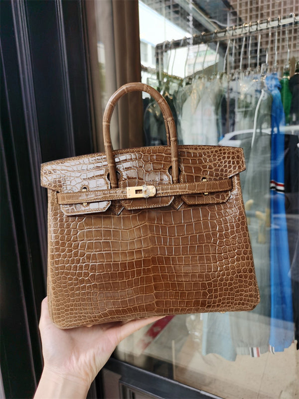 Side view of tailored structured handbag