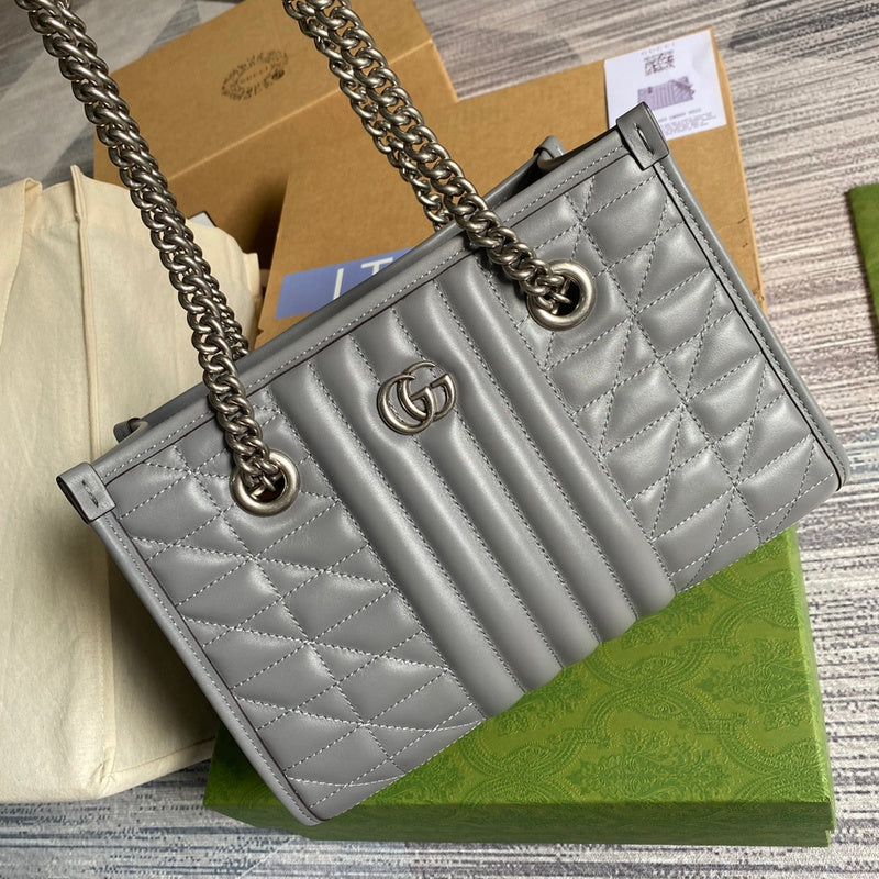 Handle and strap detail of classic modern women's handbag – women's statement bag