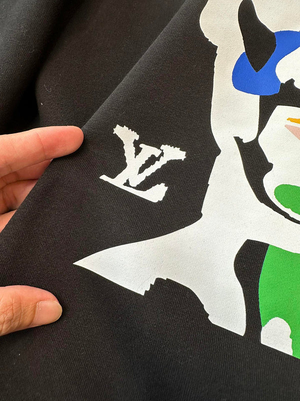 Side profile of Louis Vuitton luxury clothing with signature branding