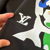 Side profile of Louis Vuitton luxury clothing with signature branding