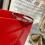 Angled view of Cartier unisex jewelry piece