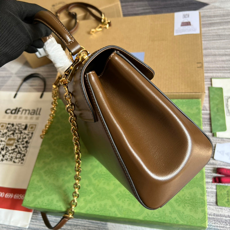 Side view of understated structured handbag