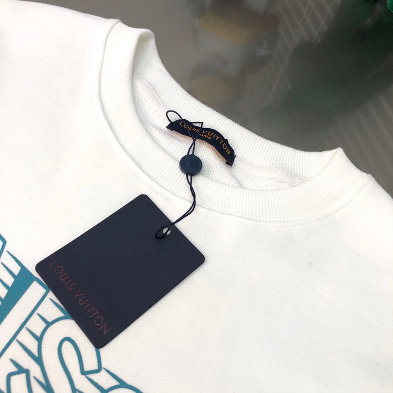Close-up detail shot of Louis Vuitton luxury clothing with signature branding
