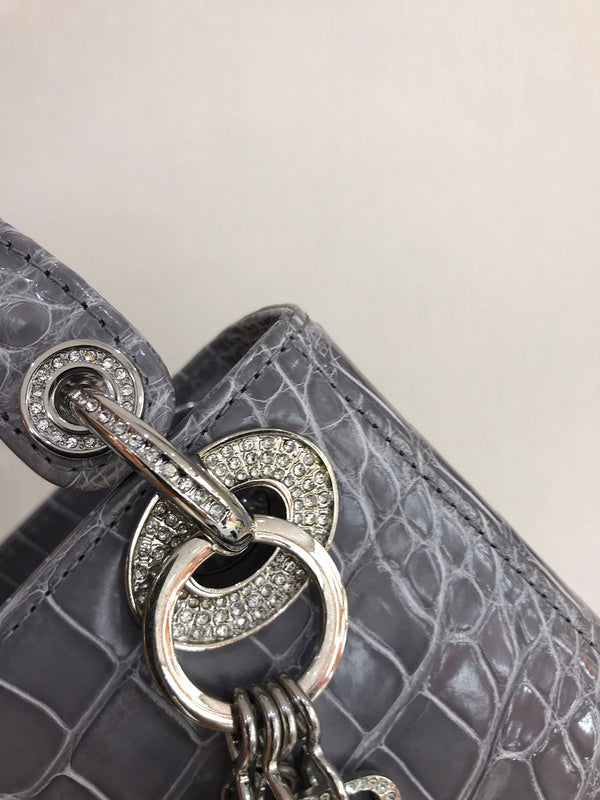 Close-up detail of signature sleek women's handbag – women's designer-style accessory