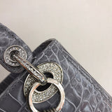 Close-up detail of signature sleek women's handbag – women's designer-style accessory
