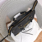 Handle and strap detail of refined statement women's handbag – women's luxury handbag