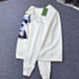 Side profile of Gucci luxury clothing with signature branding