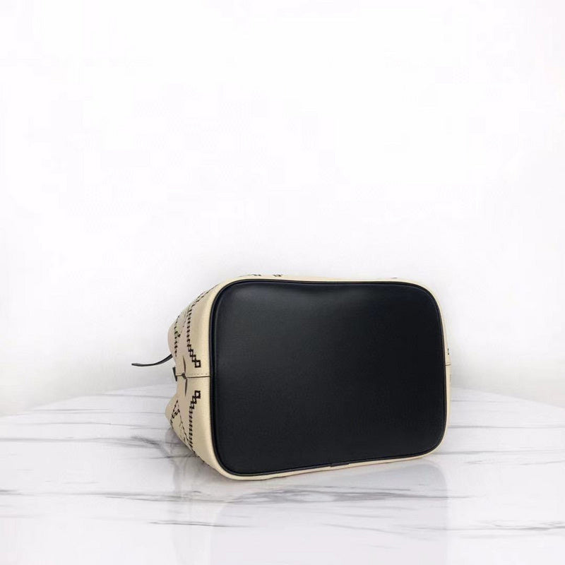 Styled lifestyle shot of structured refined women's handbag – women's luxury handbag