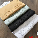 Back view of Moncler luxury clothing with signature branding