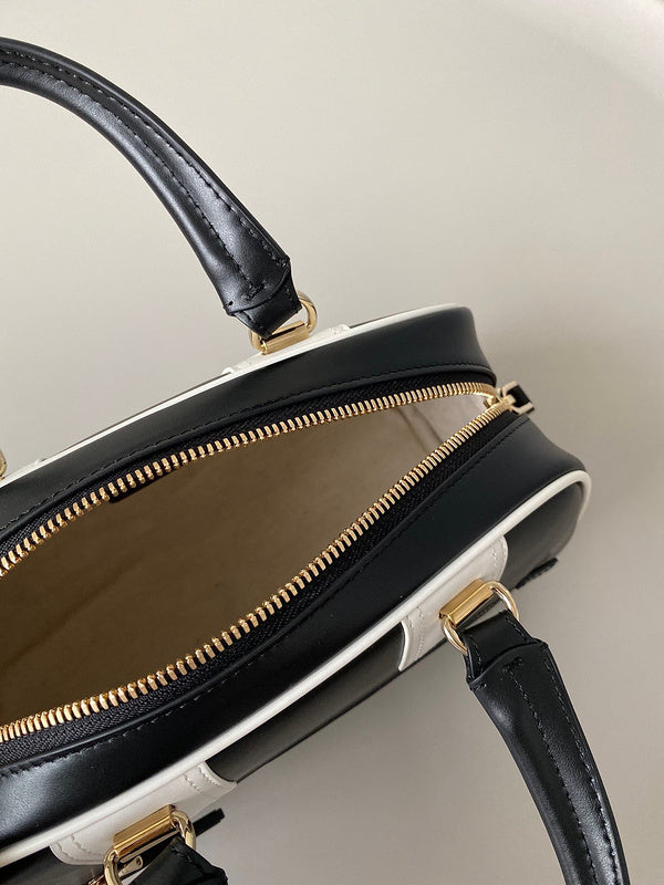 Handle and strap detail of signature everyday-luxe women's handbag – women's designer-style accessory