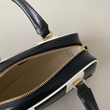 Handle and strap detail of signature everyday-luxe women's handbag – women's designer-style accessory