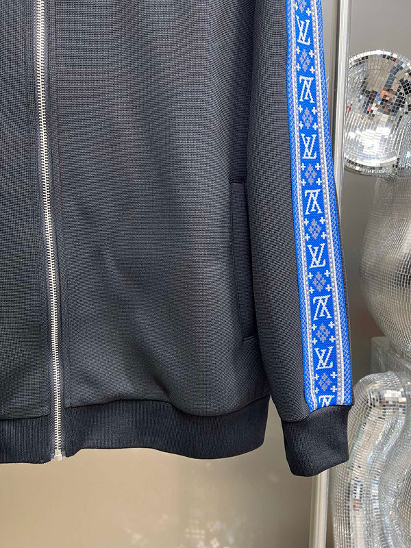 Flat lay presentation of Louis Vuitton luxury clothing with runway-inspired design