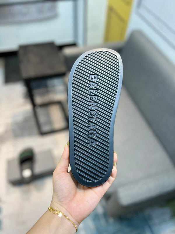 Balenciaga Black Flat Thong Sandals - Angled View