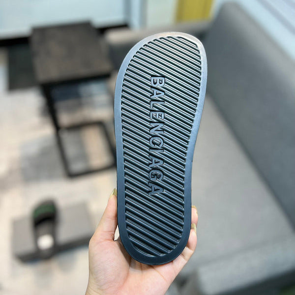 Balenciaga Black Flat Thong Sandals - Angled View