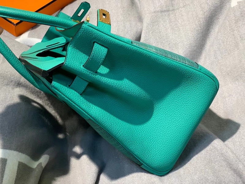 Side view of refined structured handbag