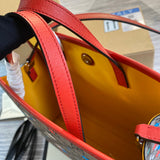 Styled lifestyle shot of signature statement women's handbag – women's luxury handbag