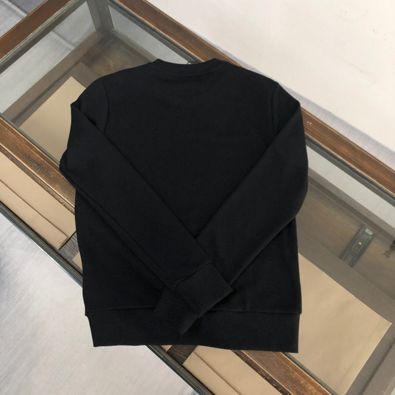 Close-up detail shot of Gucci luxury clothing with relaxed-fit cut