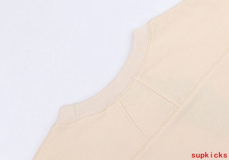 Side profile of Rhude luxury clothing with streetwear-inspired cut