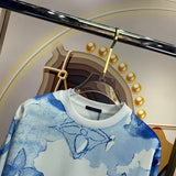 Full styled look of Louis Vuitton luxury clothing with signature branding