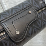 Styled lifestyle shot of structured sleek women's handbag – women's luxury accessory