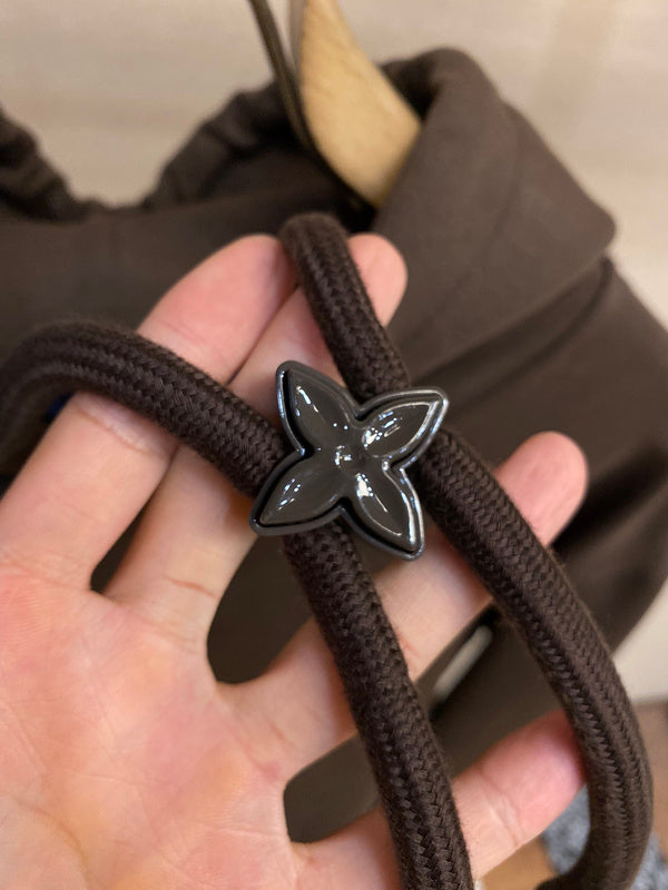 Flat lay presentation of Louis Vuitton luxury clothing with streetwear-inspired cut