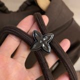 Flat lay presentation of Louis Vuitton luxury clothing with streetwear-inspired cut