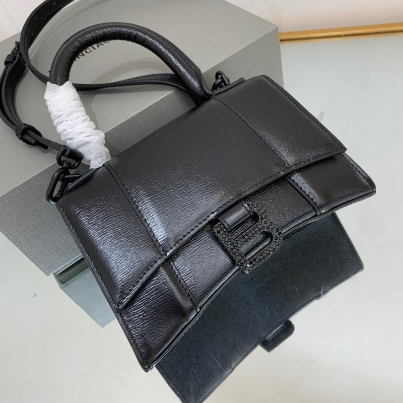 Zivas Charm Chic Craftsmanship Statement Handbag (Contemporary Shape Language) – Styled Look