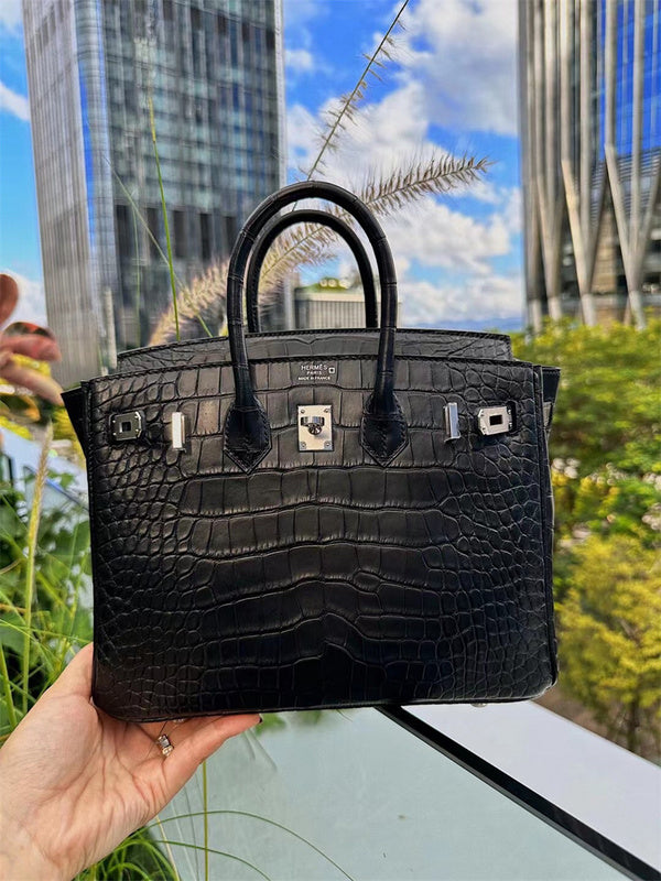 Side view of structured structured handbag
