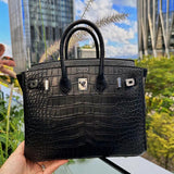 Side view of structured structured handbag