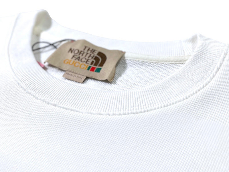 Close-up detail shot of Gucci luxury clothing with relaxed-fit cut