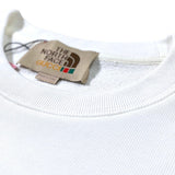 Close-up detail shot of Gucci luxury clothing with relaxed-fit cut