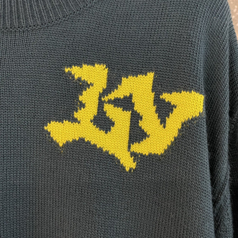 Full styled look of Louis Vuitton luxury clothing with label-forward styling