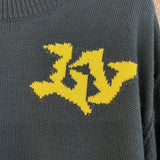 Full styled look of Louis Vuitton luxury clothing with label-forward styling