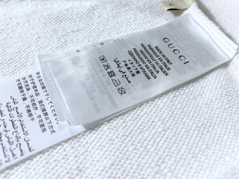 Close-up detail shot of Gucci luxury clothing with tailored silhouette