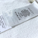 Close-up detail shot of Gucci luxury clothing with tailored silhouette