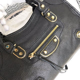 Handle and strap detail of structured premium women's handbag – women's luxury accessory