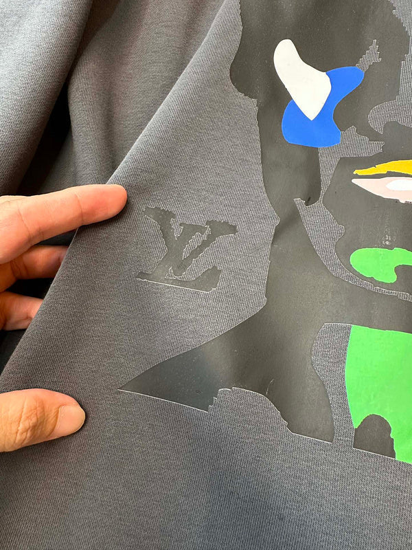 Side profile of Louis Vuitton luxury clothing with tailored silhouette