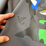 Side profile of Louis Vuitton luxury clothing with tailored silhouette