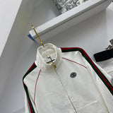 Close-up detail shot of Gucci luxury clothing with label-forward styling