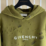 Close-up detail shot of Givenchy luxury clothing with logo-detail design