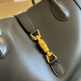 Styled lifestyle shot of structured everyday-luxe women's handbag – women's designer-style accessory