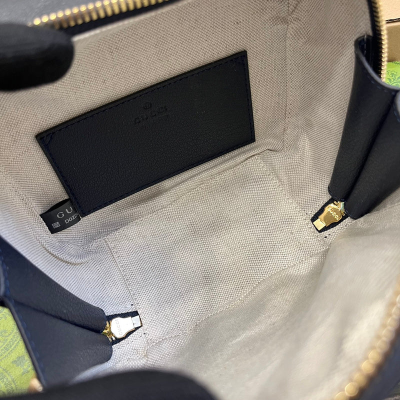 Handle and strap detail of modern classic women's handbag – women's luxury accessory