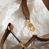 Side profile of chic statement women's handbag – women's designer-style accessory