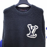 Front view of Louis Vuitton luxury clothing with label-forward styling