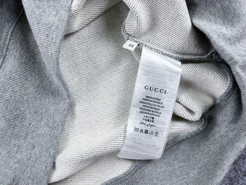 Side profile of Gucci luxury clothing with monogram-inspired silhouette