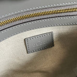 Side profile of premium polished women's handbag – women's designer-style accessory