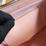 Side profile of premium signature women's handbag – women's designer-style accessory