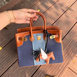 Side view of timeless structured handbag